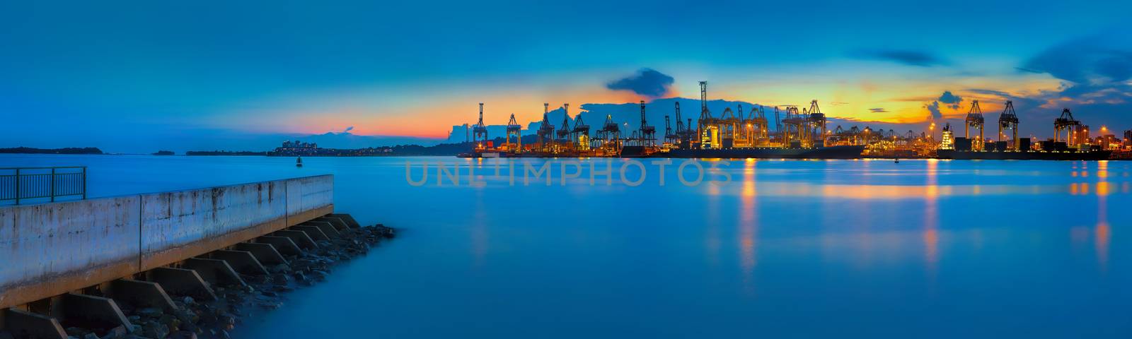 Panoramic view of Singapore container port at sunset