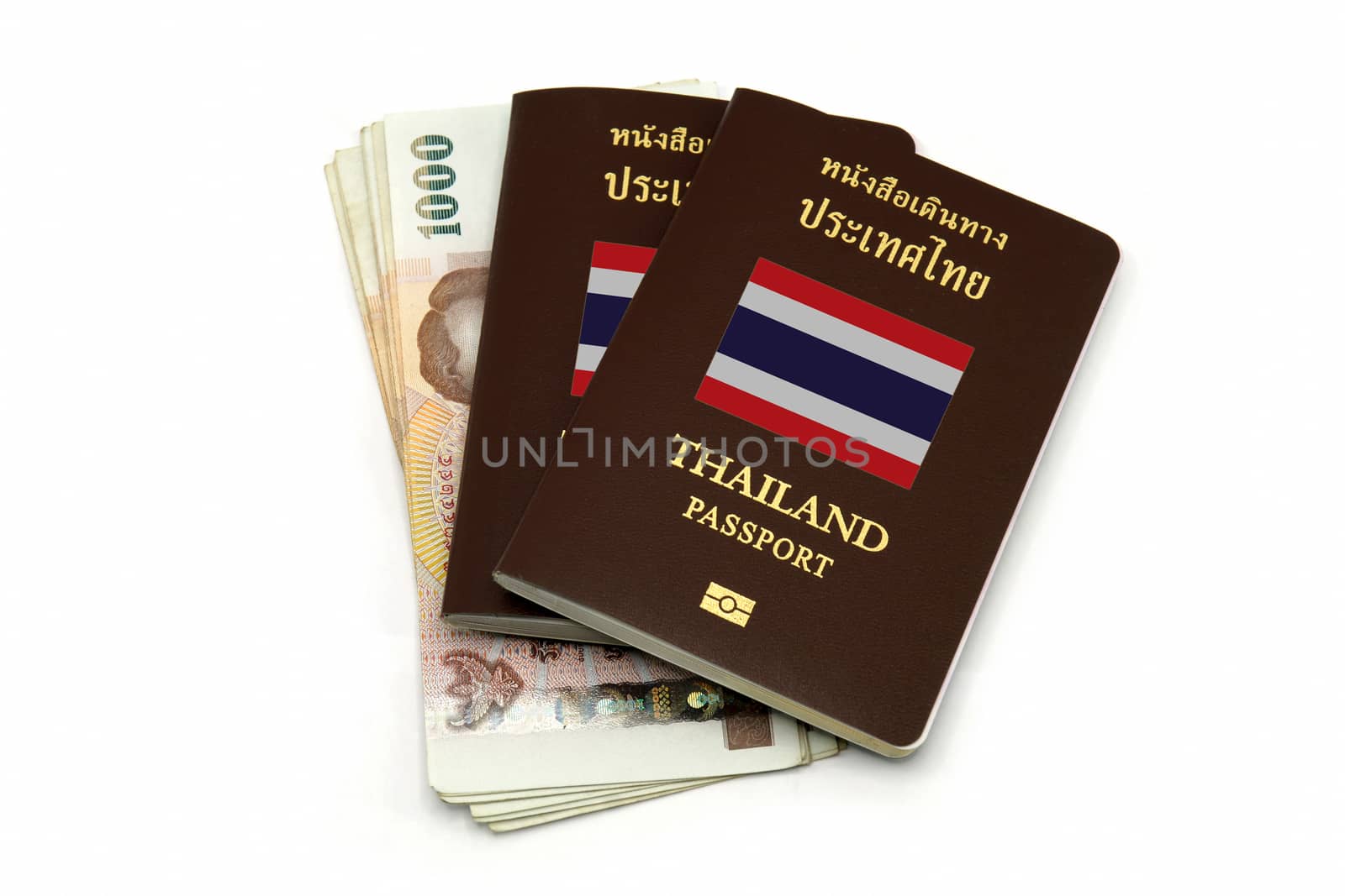 Thailand passport and Thai money for Travel or A.E.C. concept by mranucha