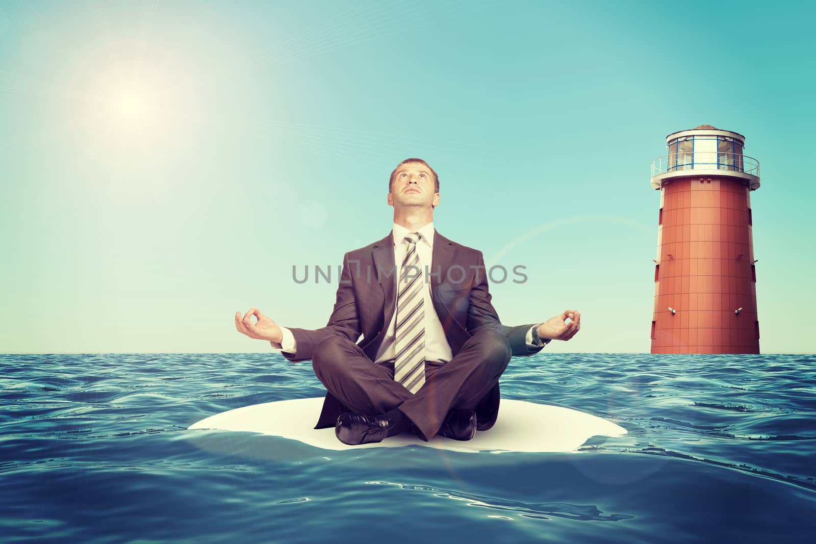 Businessman sitting in lotus position on island  by cherezoff