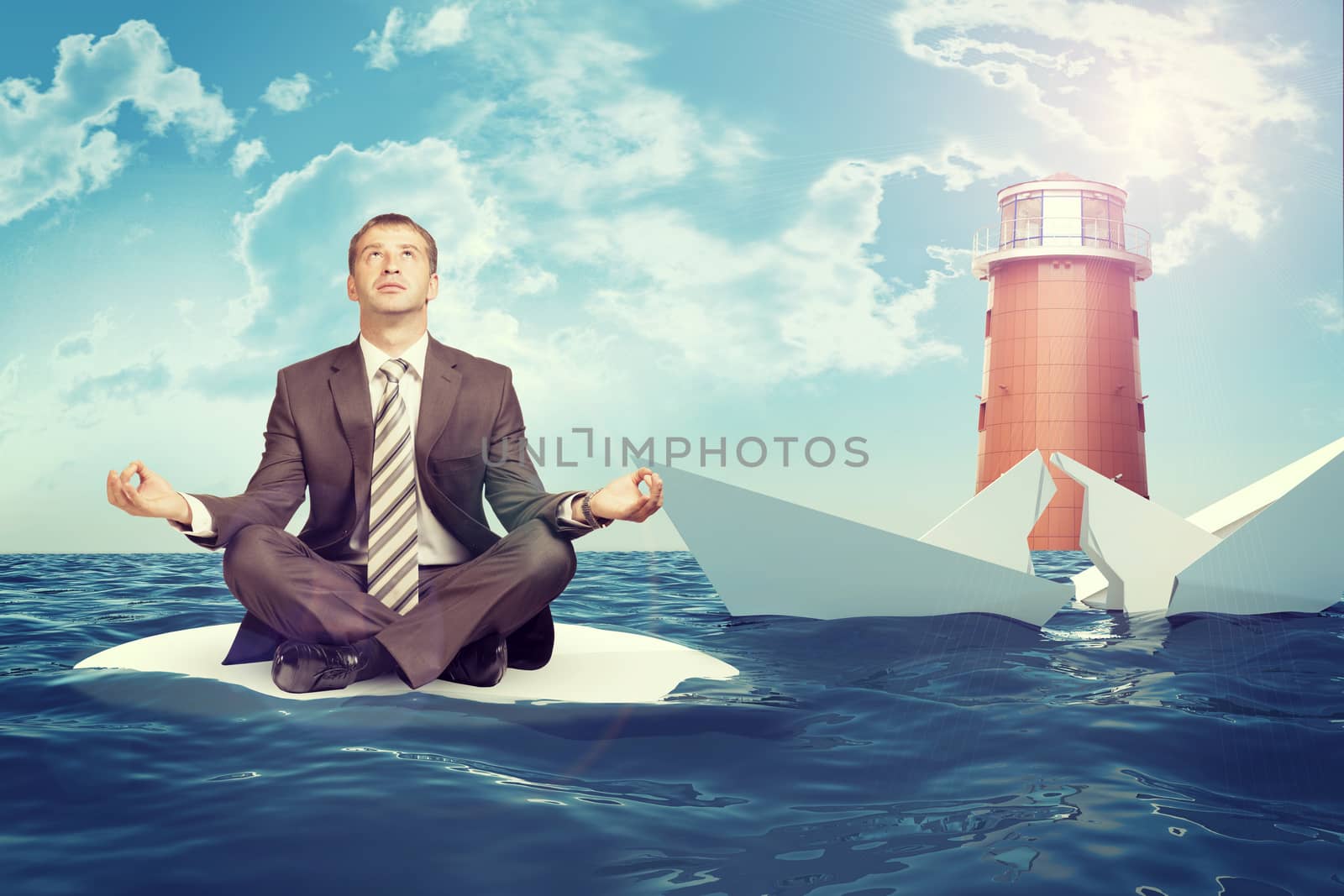 Businessman sitting in lotus position on small sand island in sea and looking up, sinking broken paper boat on right side