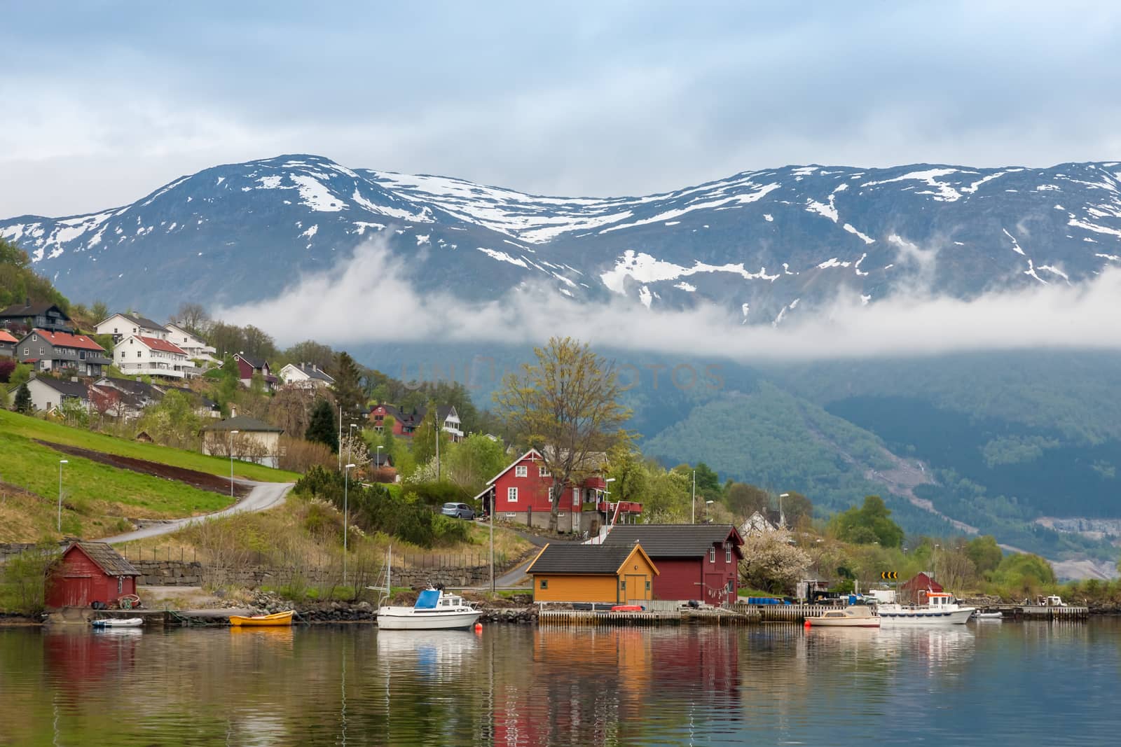 Landscape with mountains.  village in Norwegian fjords by master1305