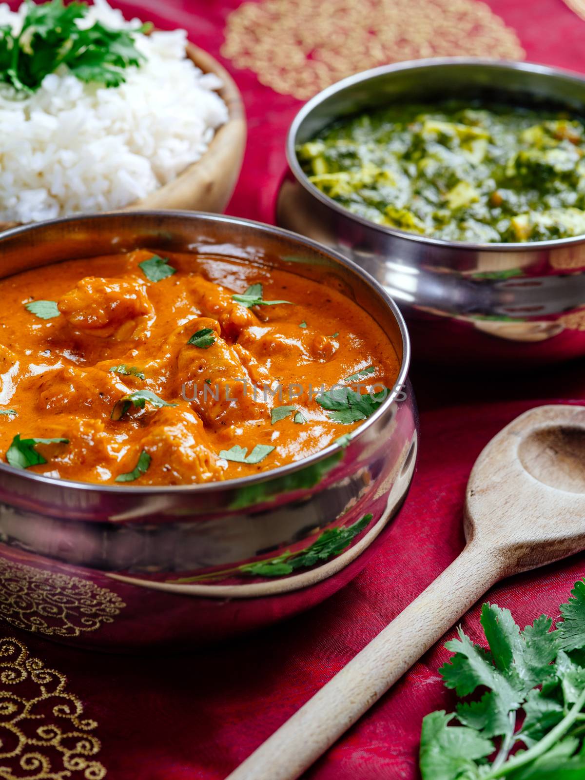Photo of an Indian meal of Butter Chicken, rice and Saag Paneer