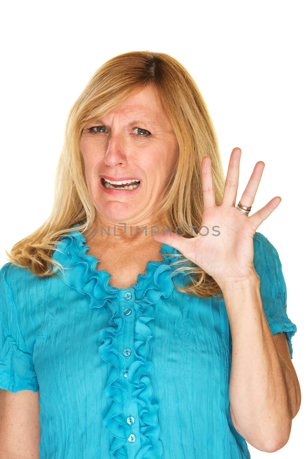 Disgusted woman in blue holding hand up