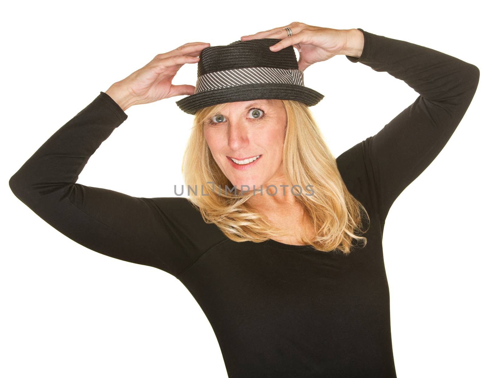 Pretty middle aged dancer in black holding hat