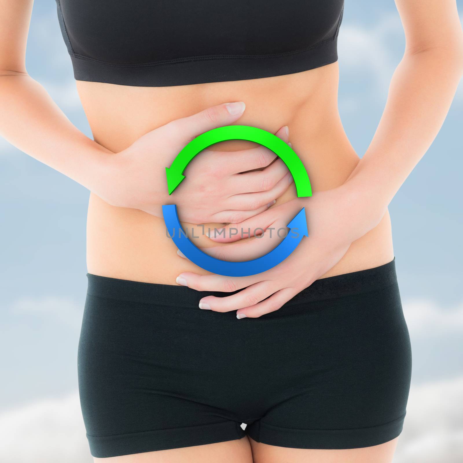 Composite image of mid section of a fit young woman with stomach pain by Wavebreakmedia