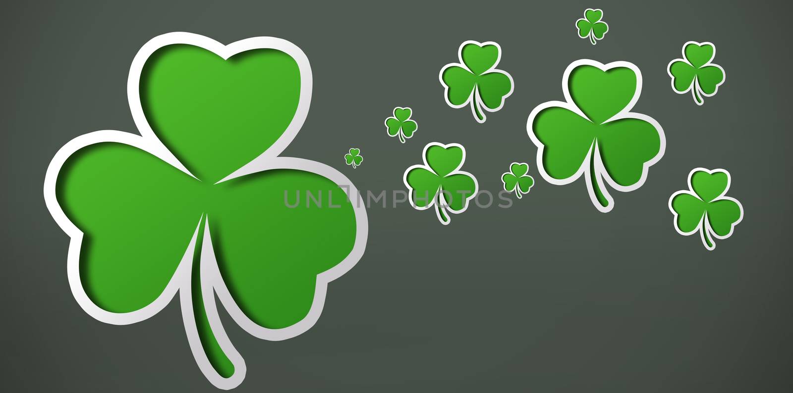 Many shamrocks on a grey background