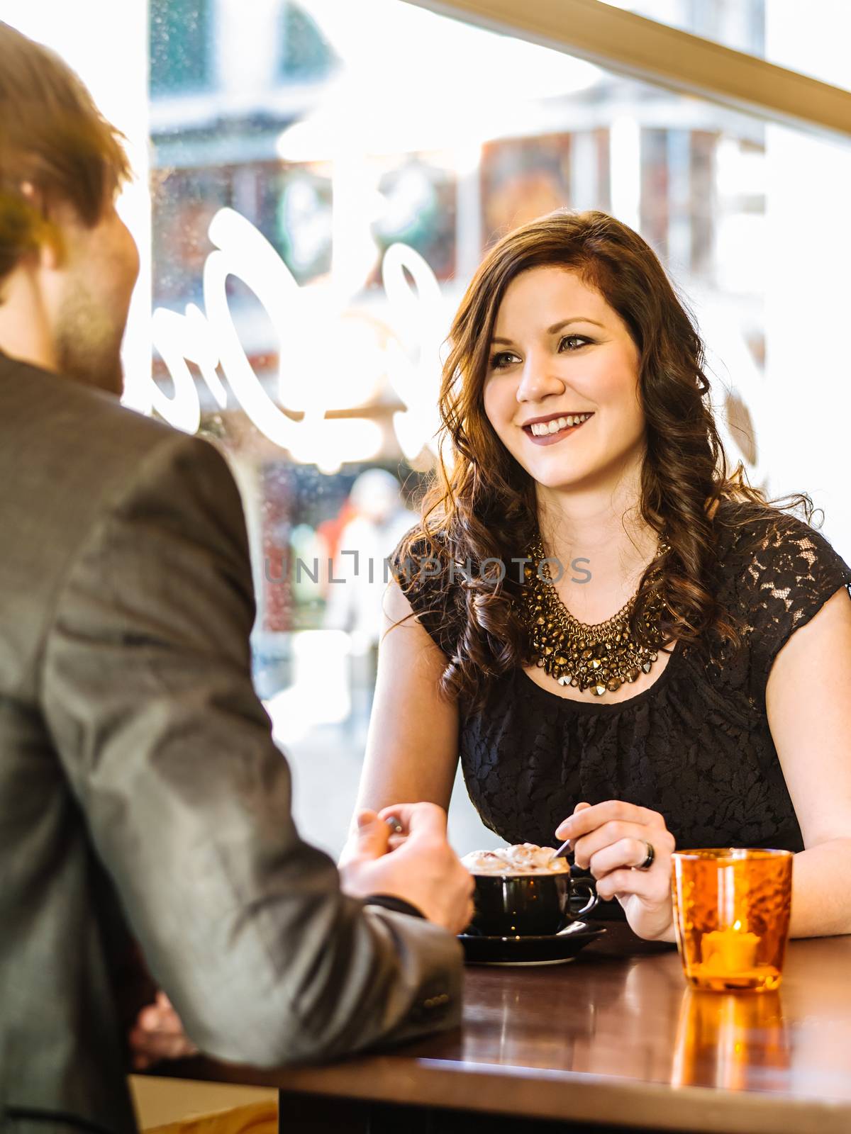 Couple enjoying cappuccino at the restaurant by sumners