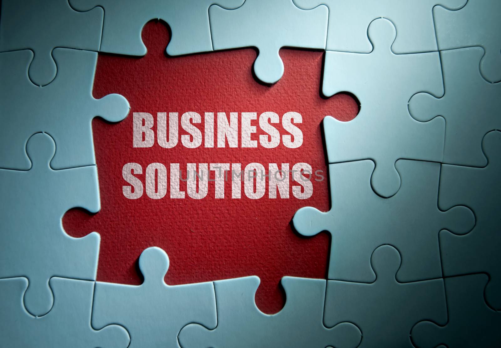Missing pieces from a jigsaw puzzle revealing business solutions