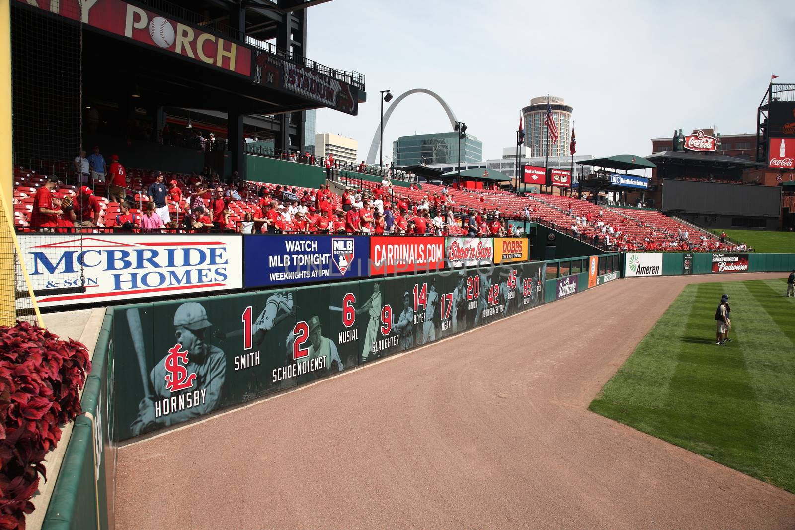 Fans watch for a batting practice home run ball at a late season St. Louis Cardinals baseball game at Busch Stadium.