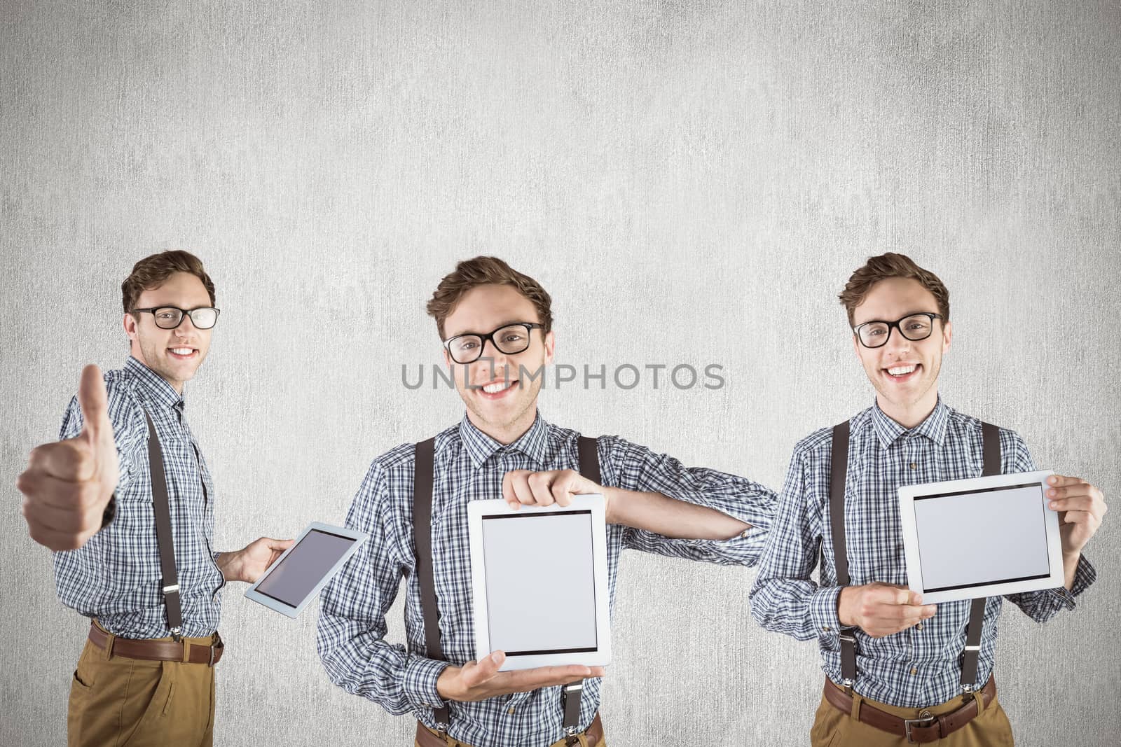 Nerd with tablet pc against white and grey background