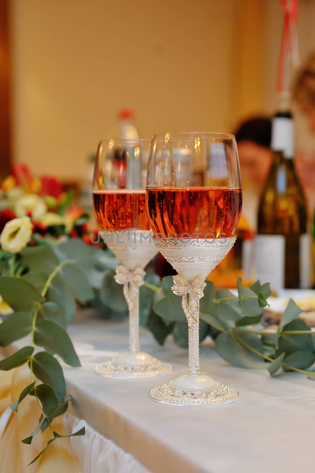 Champagne glasses on  celebratory table.