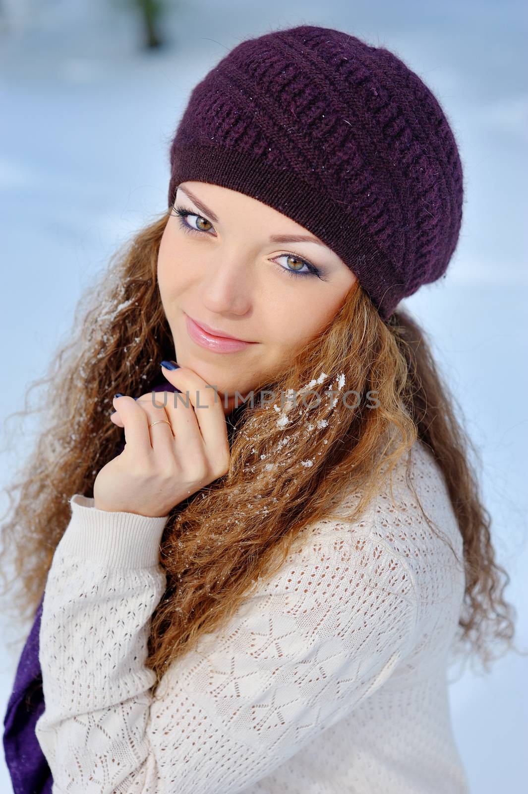 Portrait Beautiful brunette girl on a walk in winter.