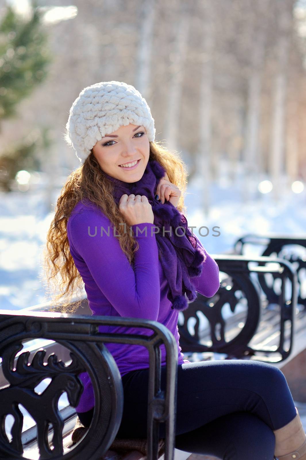 Beautiful brunette girl on a walk in winter.