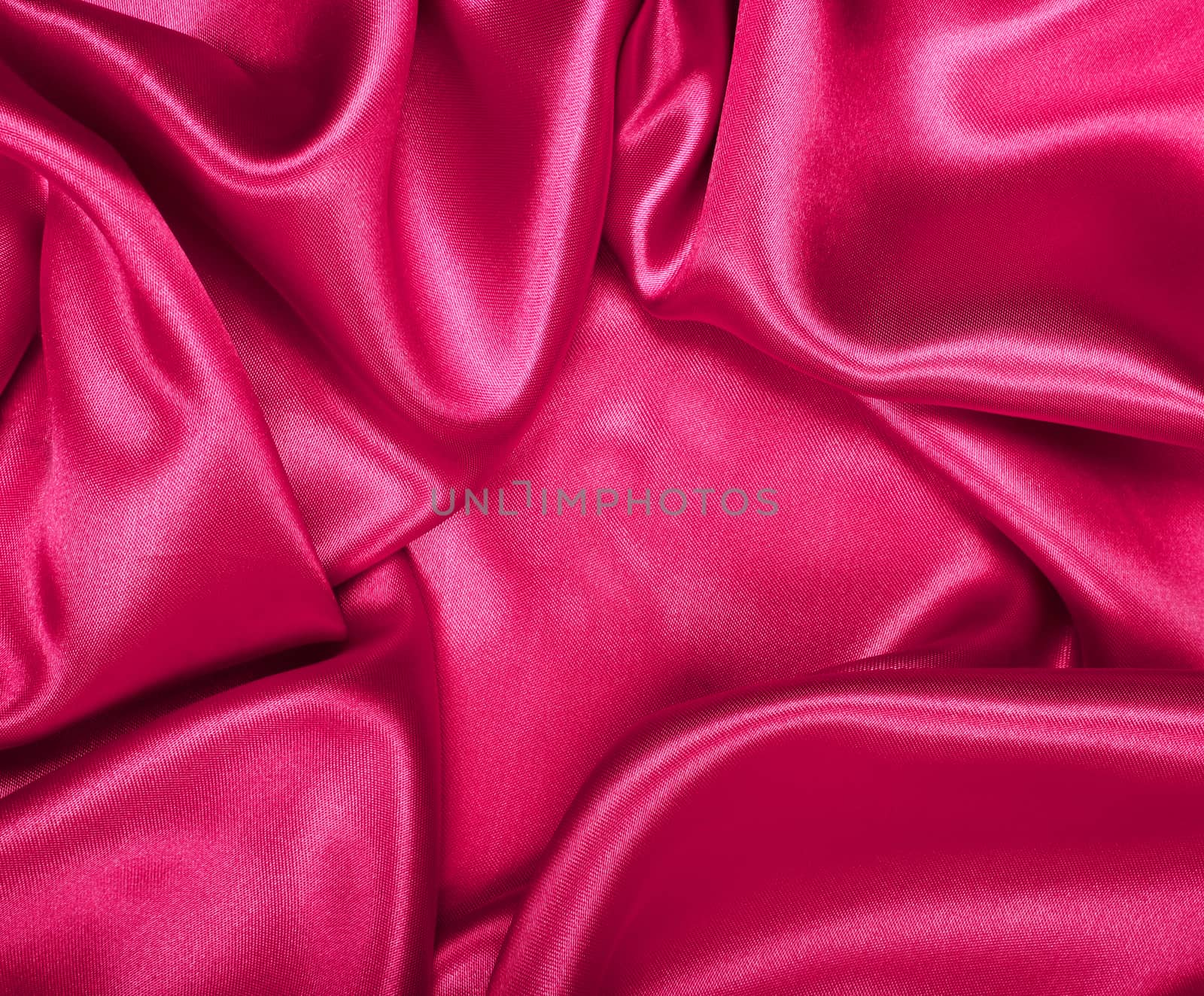 Smooth elegant pink silk or satin texture as background by oxanatravel