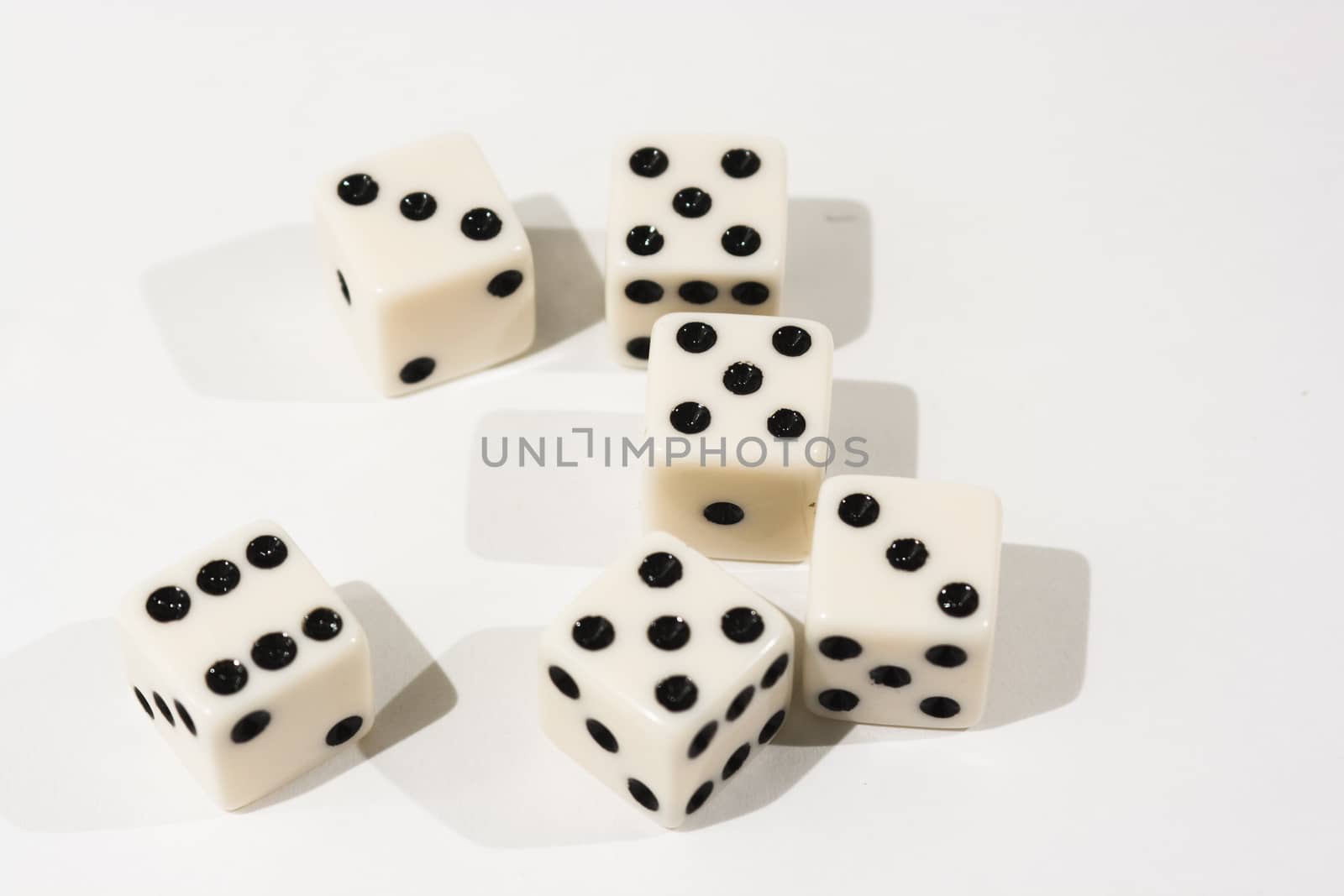 White dice shot against a white background
