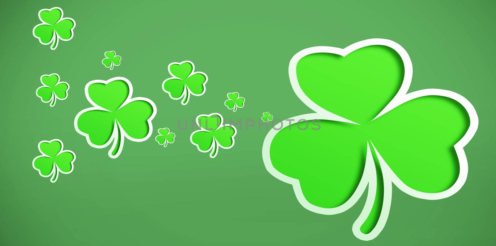 Different sized green shamrocks on green background