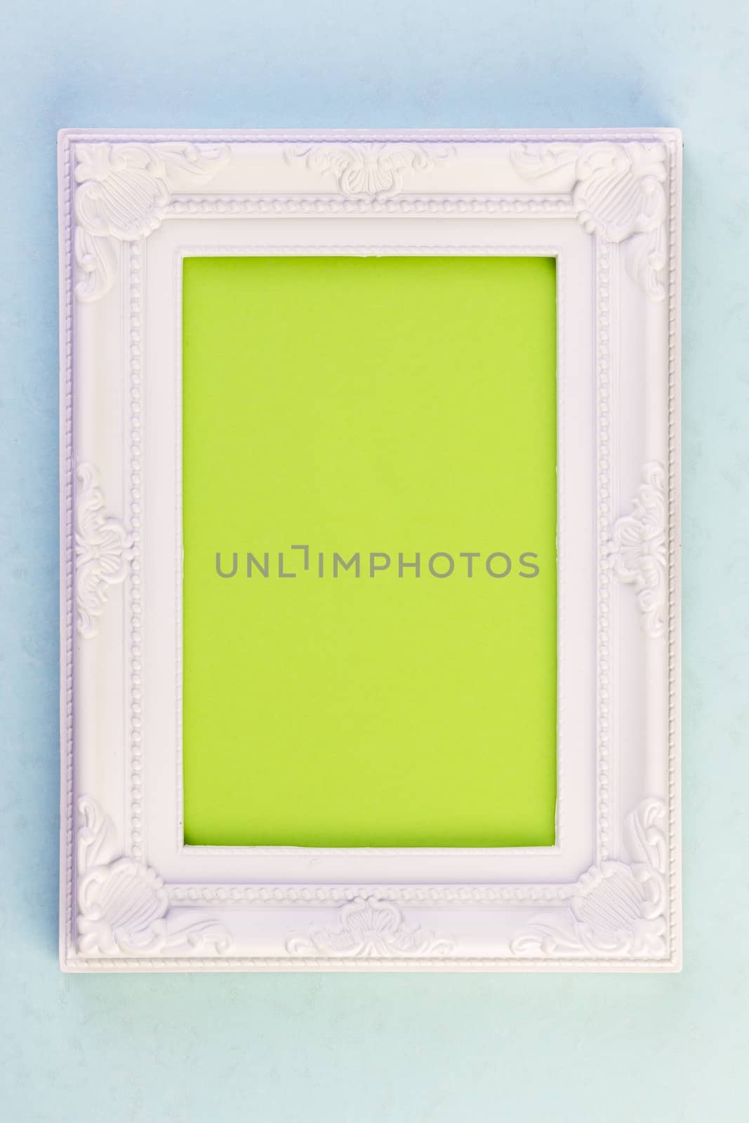 White Frame on blue background with green for your copy