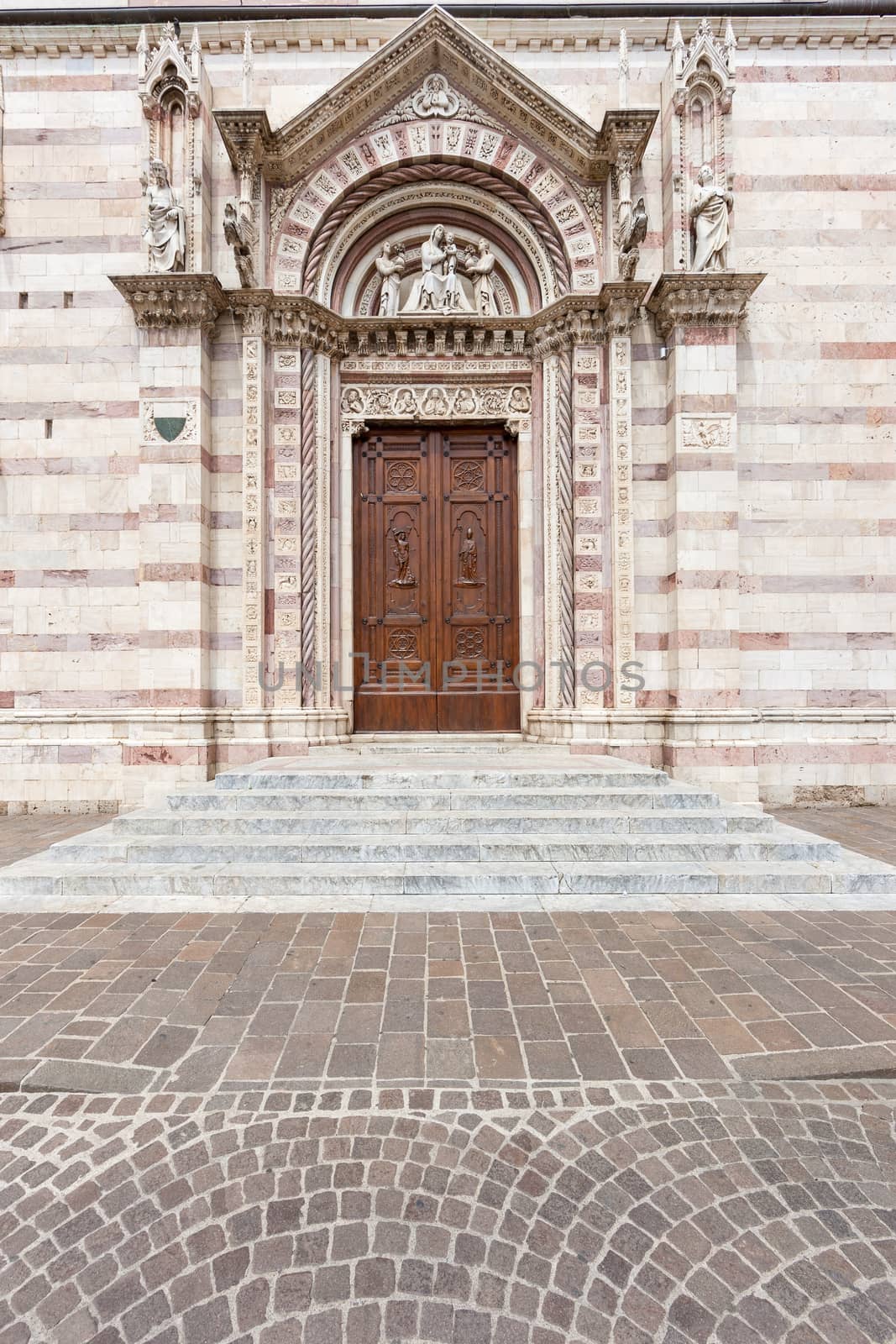 The antique doors to the church. Italy