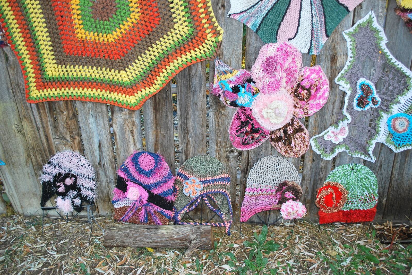 Crochet patterns displayed outdoors.