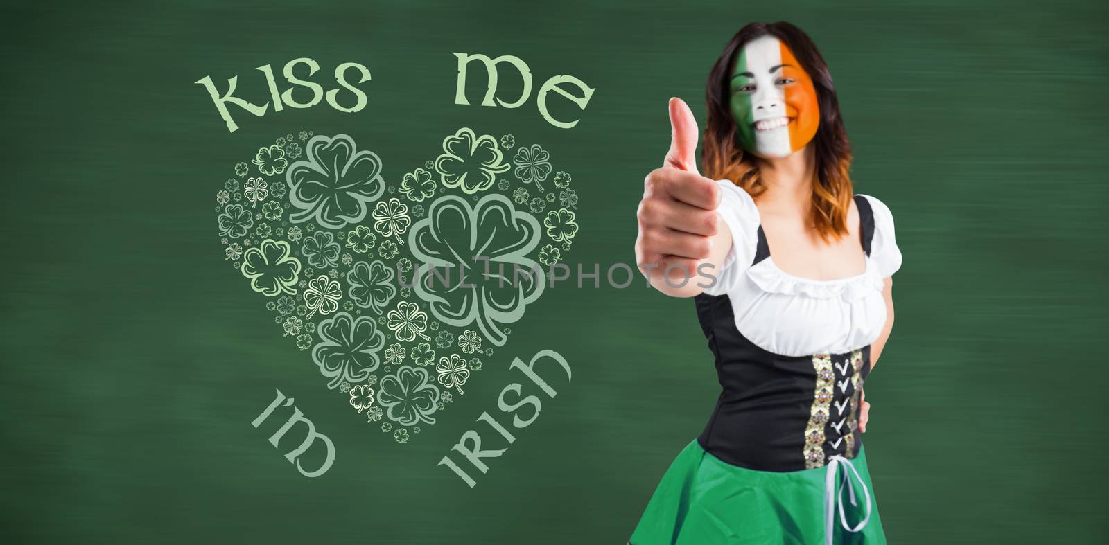 Irish girl showing thumbs up against green chalkboard