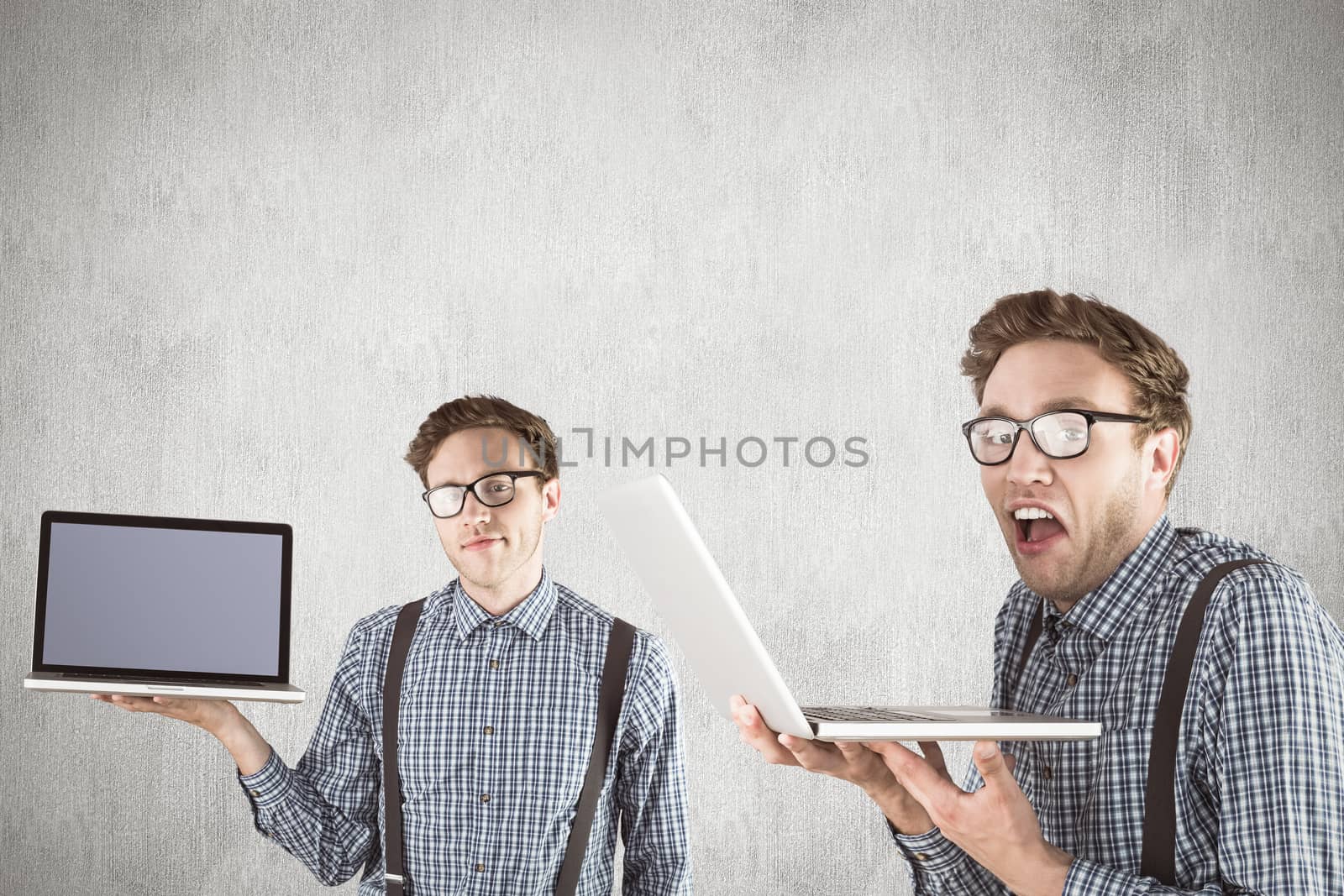 Nerd with laptop against white and grey background