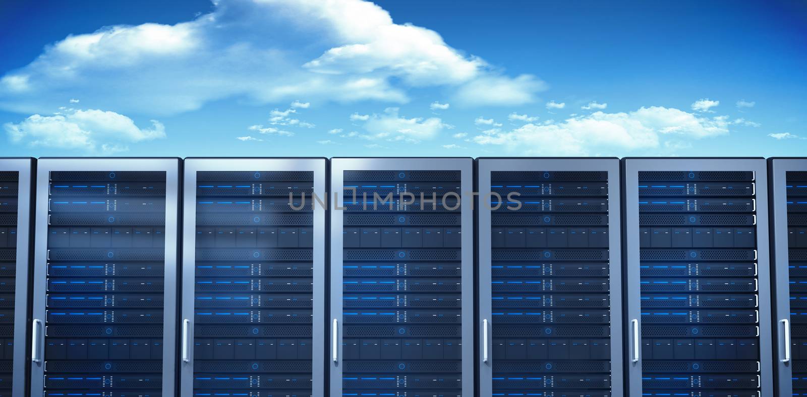 Server towers against bright blue sky with clouds