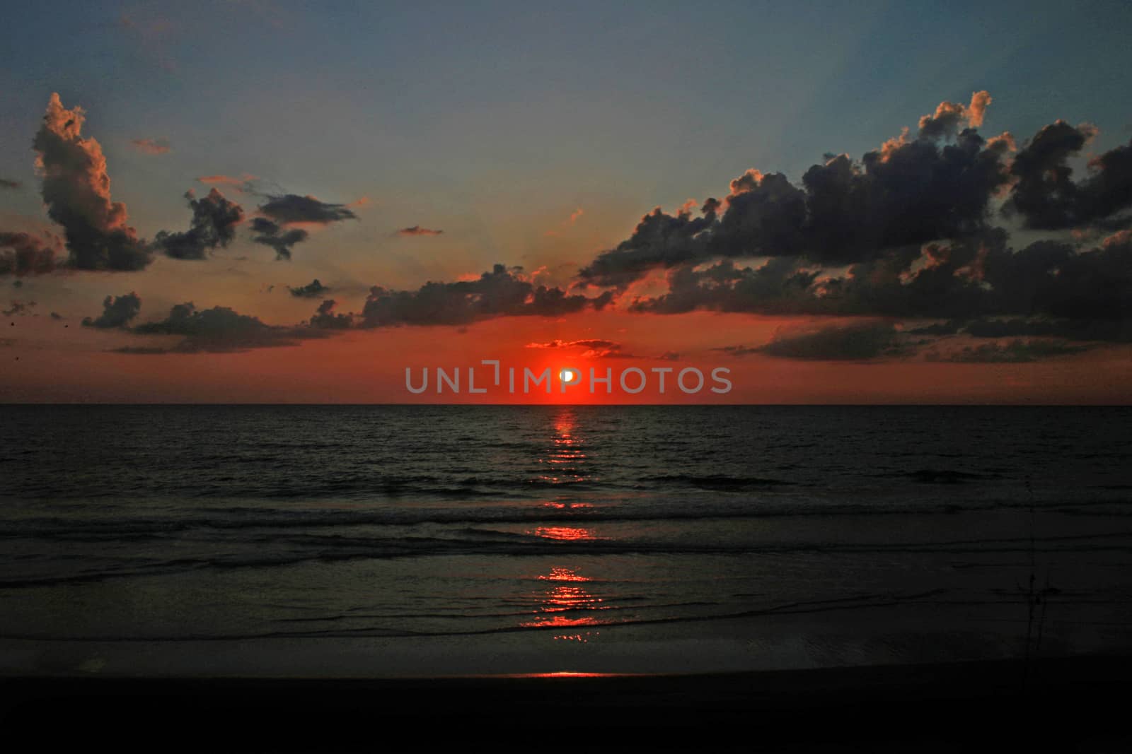 A stunning sunset with clouds over the ocean