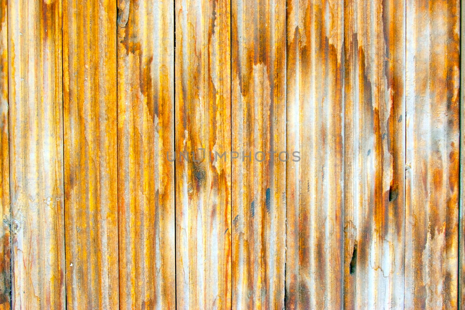 Dirty, stained by a paint the hammered together fence