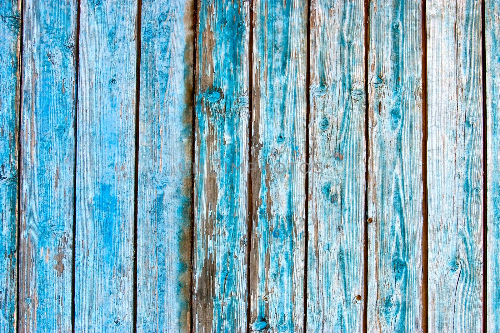 Dirty, stained by a paint the hammered together fence