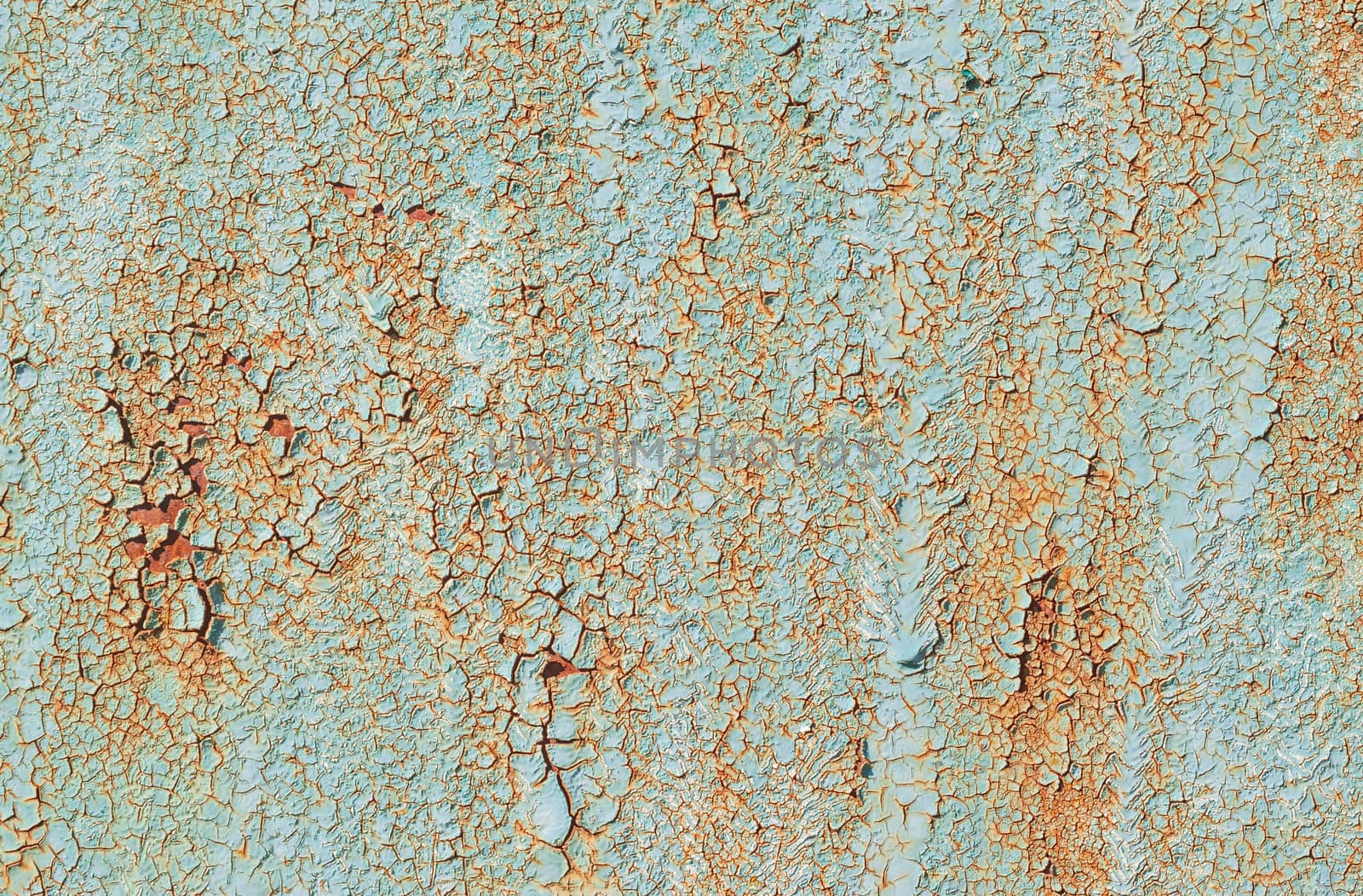 texture of old green peeling paint on metal wall