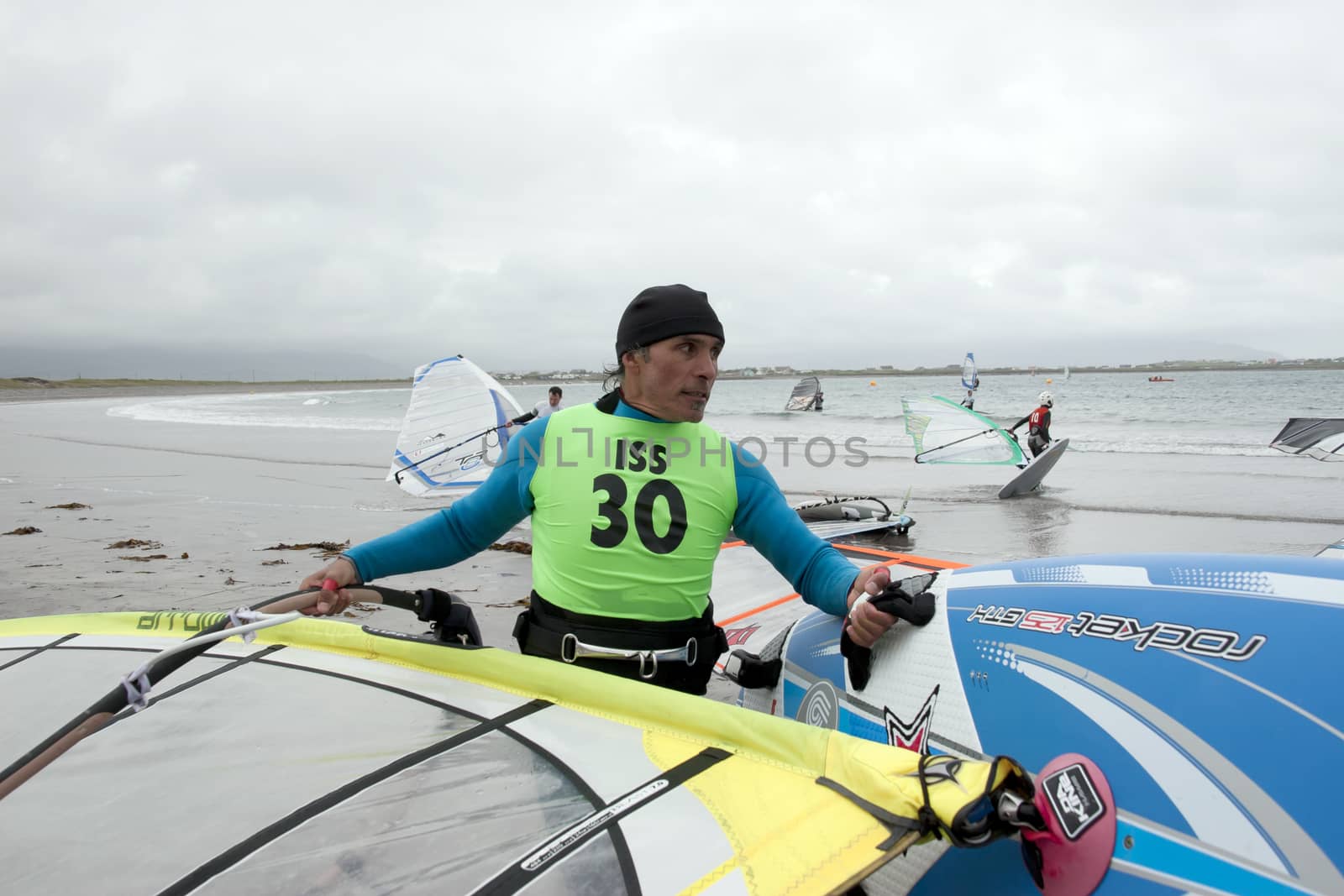 wild Atlantic way windsurfers getting ready to surf by morrbyte