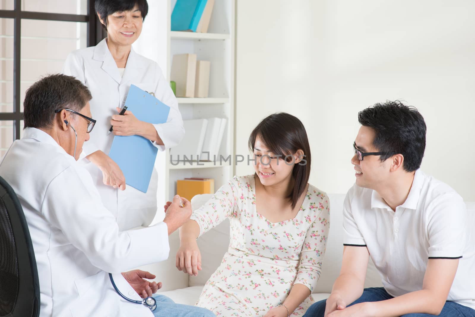 Asian couple consult doctor. Woman health concept.