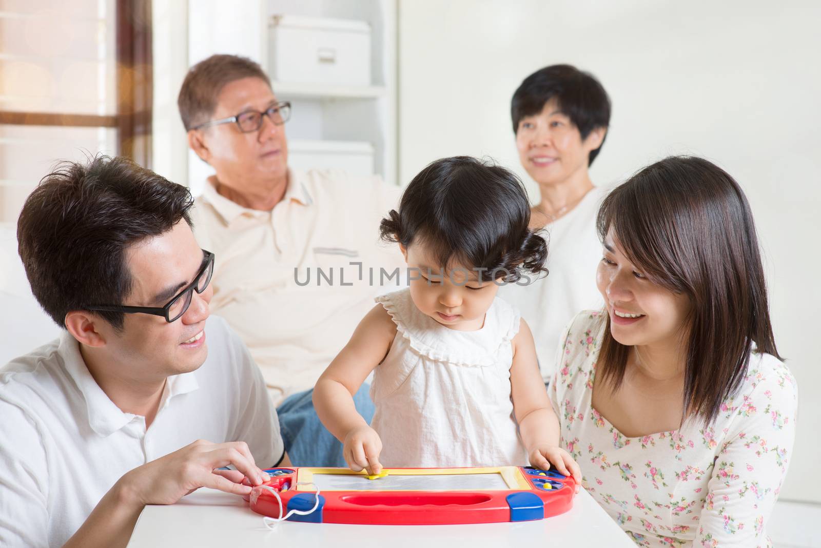 Happy family portrait. Asian multi generations having fun at home. 