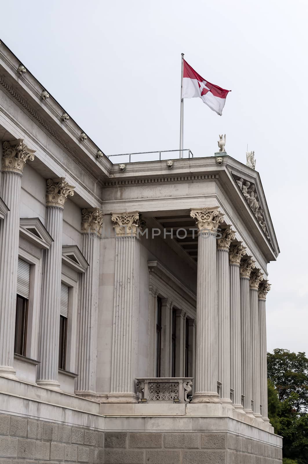 Austrian Parliament building and flag in Vienna.