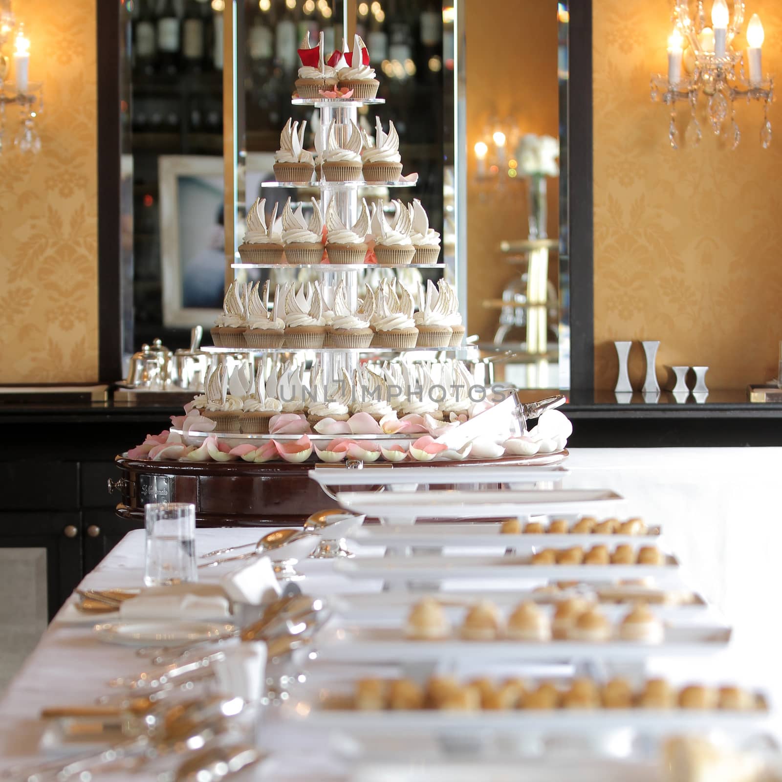 Table with cupcakes bread and dessert in party