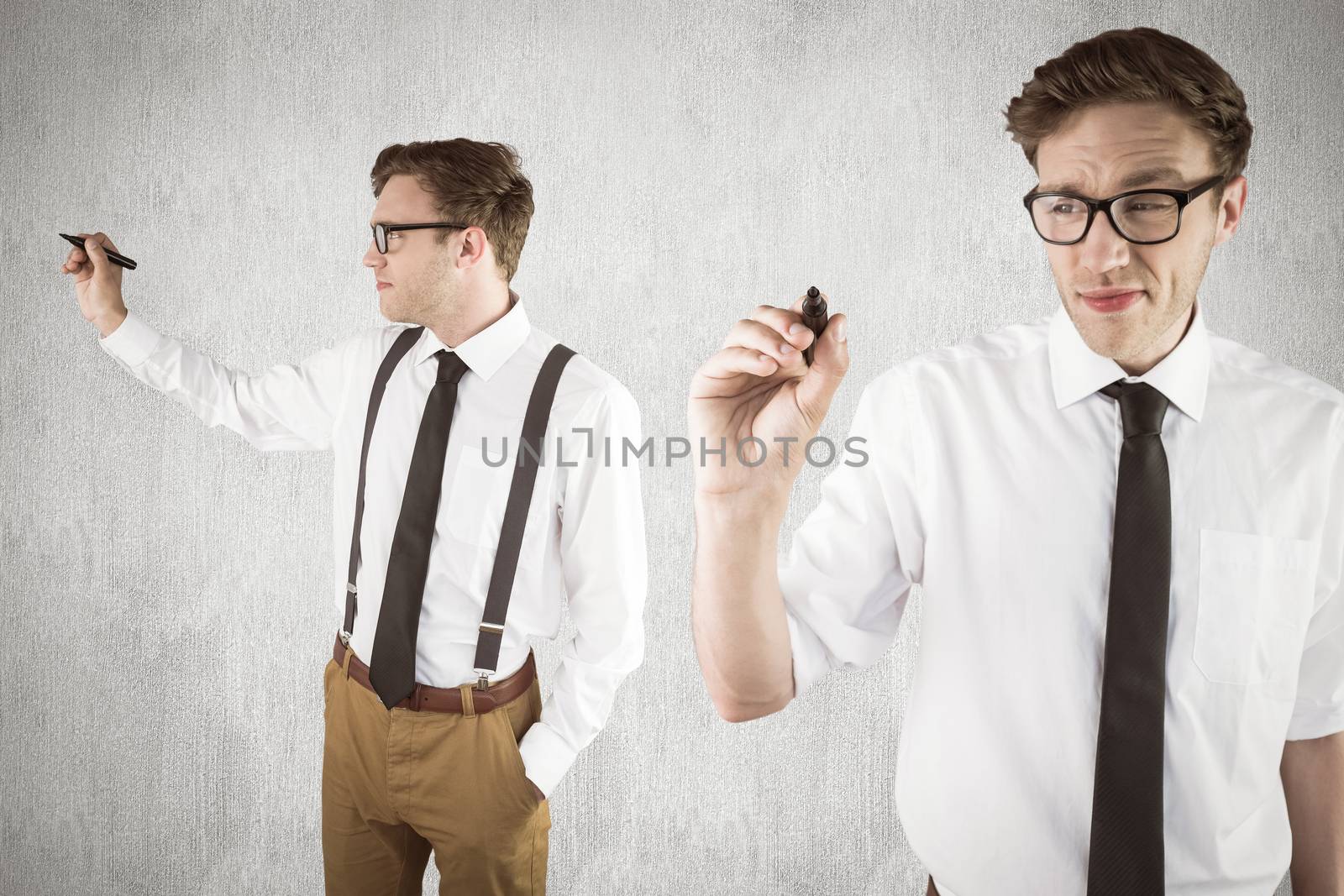 Nerdy businessman writing against white and grey background