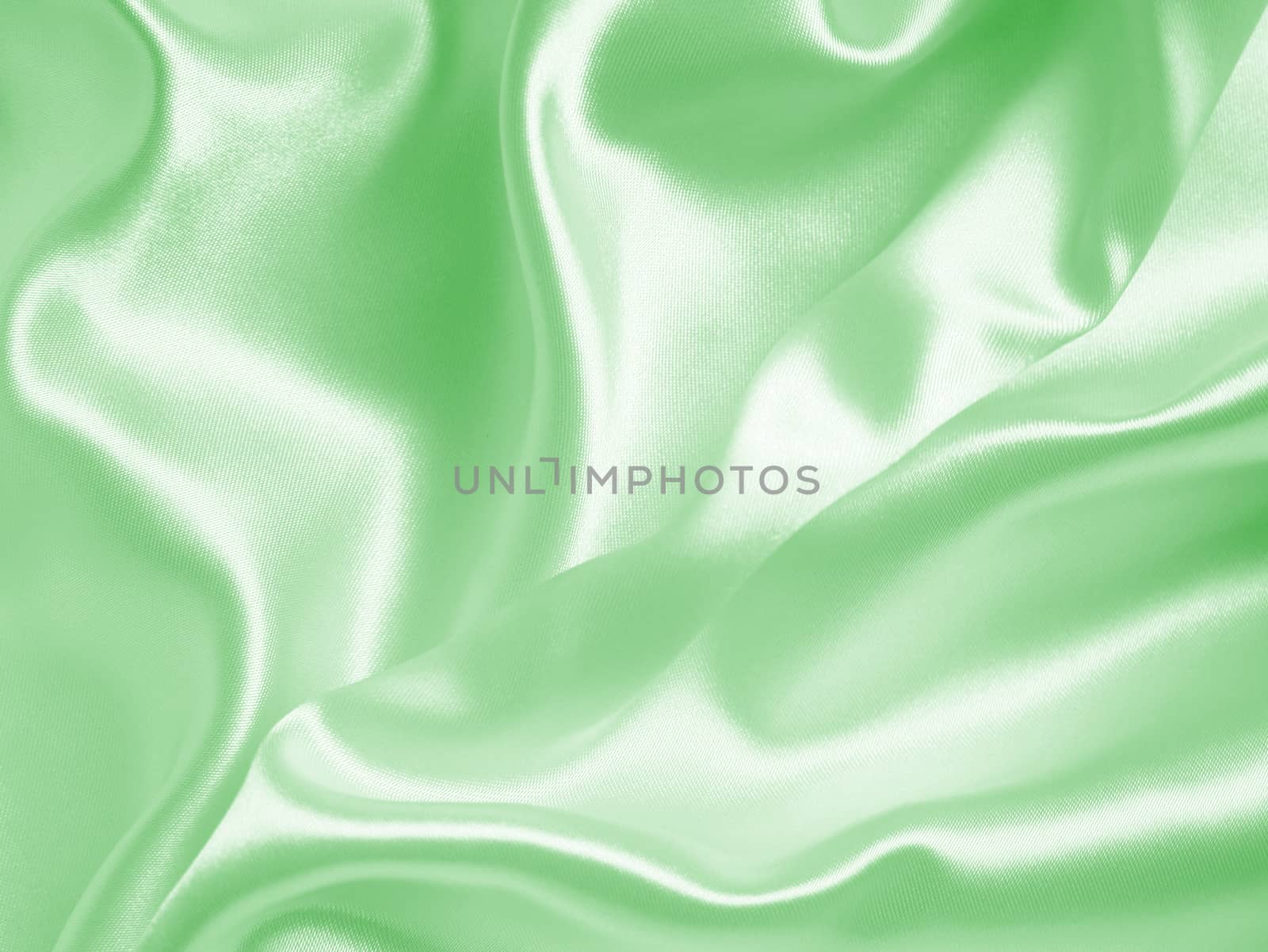 Smooth elegant green silk or satin texture as background  by oxanatravel