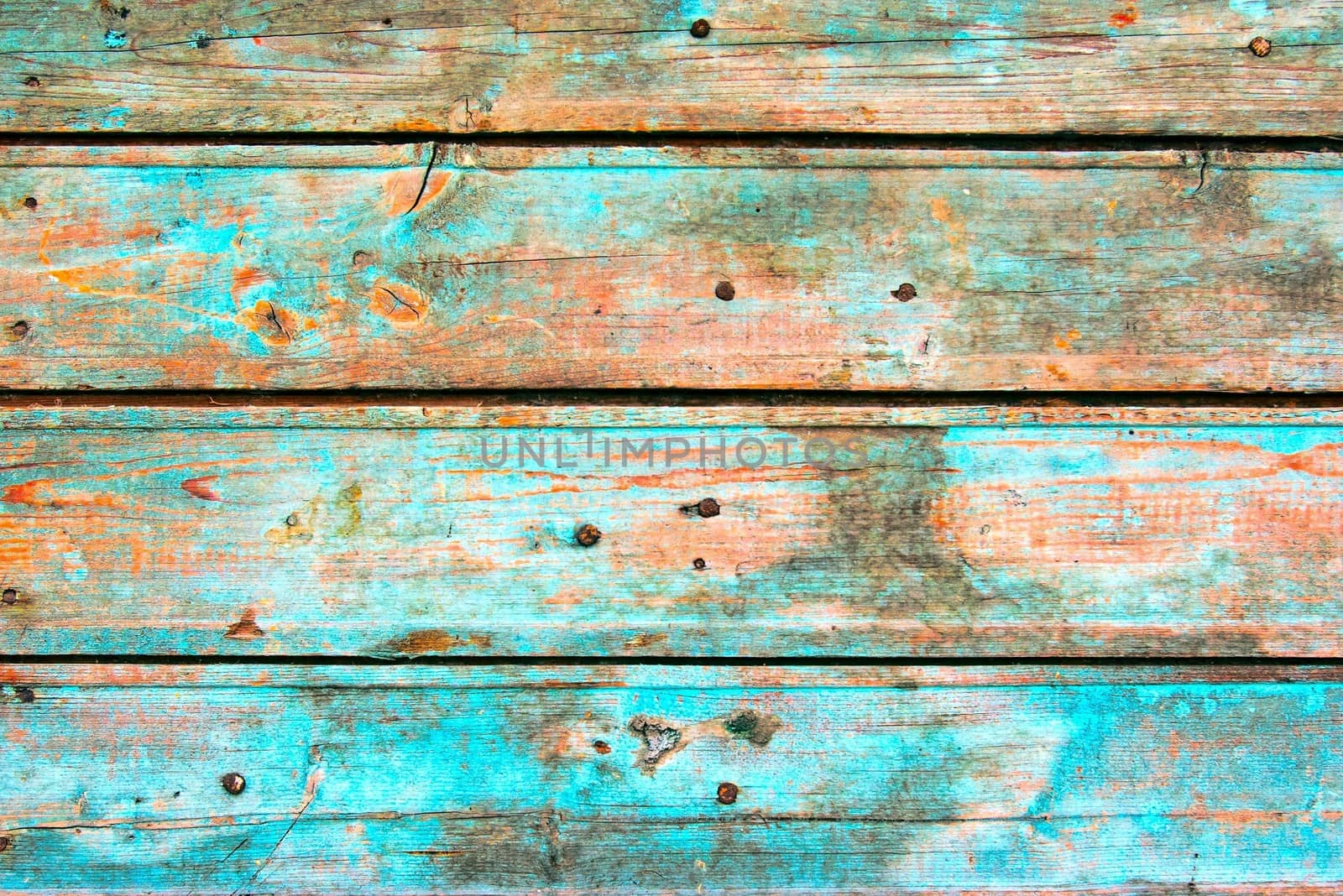 Dirty, stained by a paint the hammered together fence