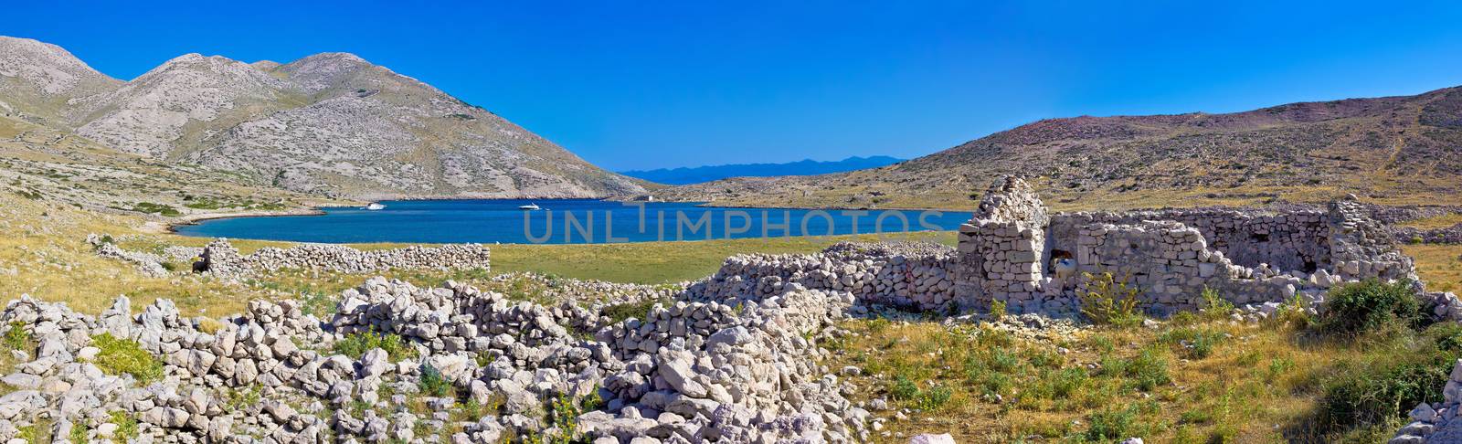 Island of Krk yachting bay panorama with historic stone ruins, Mala luka, Croatia