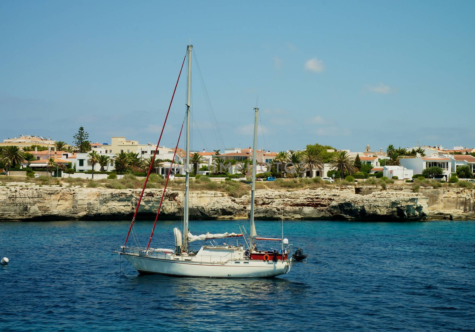 Small Yacht in Beauty Harbor near Coast of Menorca, Balearic Islands 