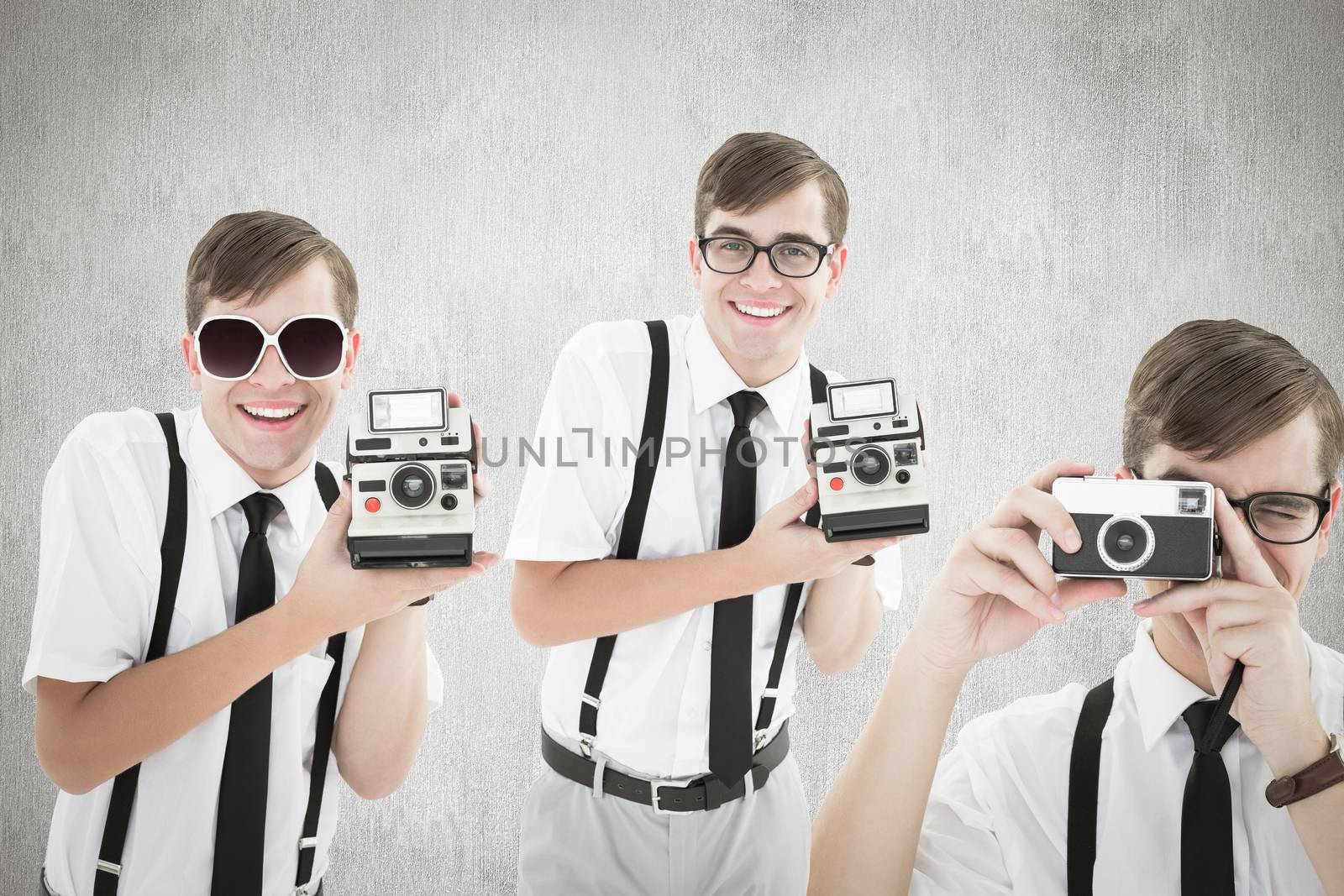 Geek with camera against white and grey background