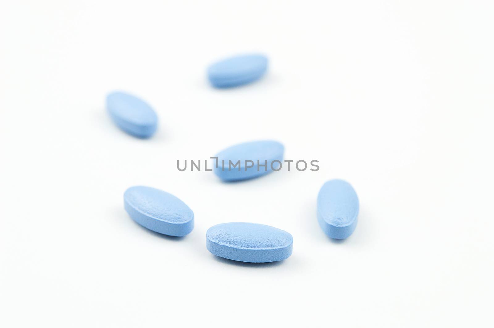 Blue tablets isolated on white background