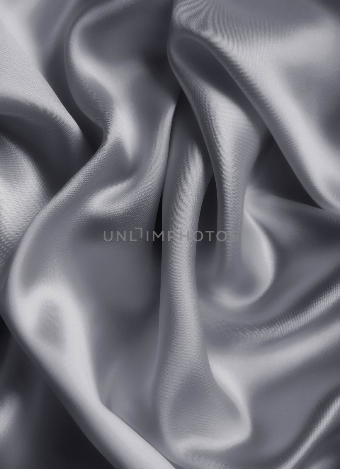 Smooth elegant grey silk or satin texture as background by oxanatravel