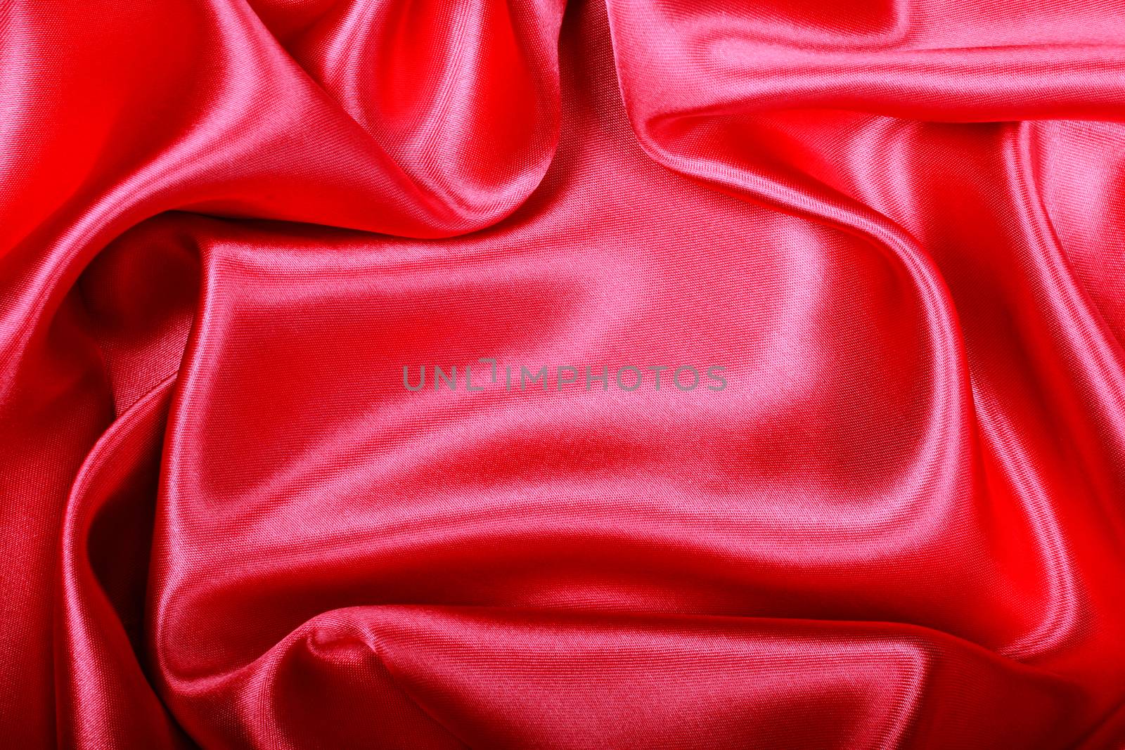 Smooth elegant red silk or satin texture as background  by oxanatravel