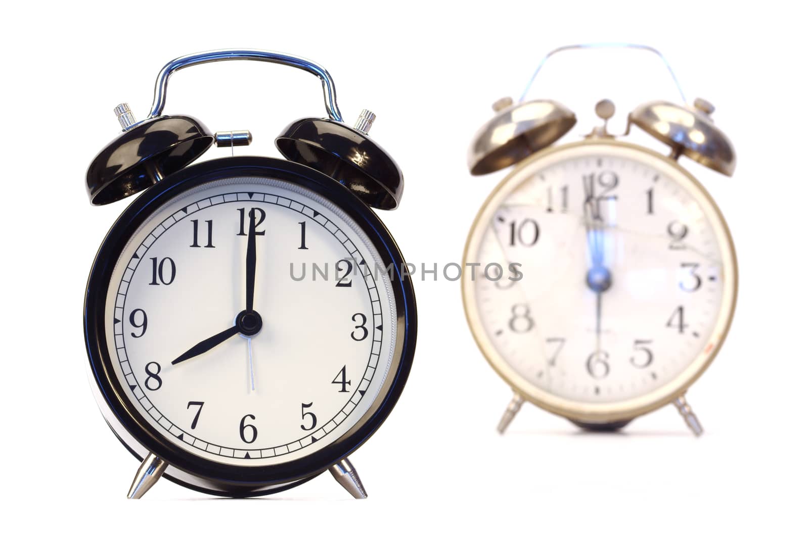 new and old broken alarm clocks over white