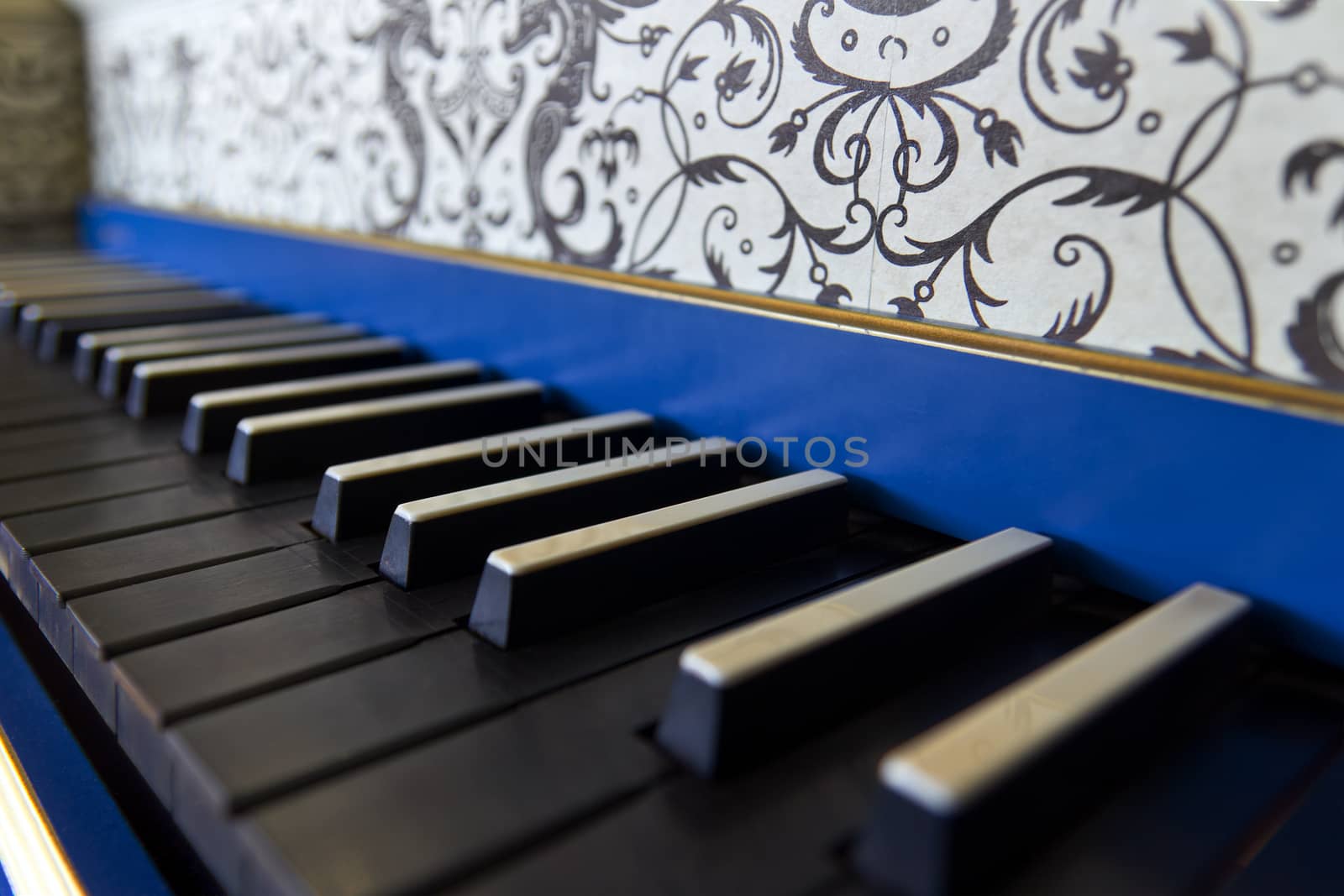 Detail of old harpsichord keyboard with black keys, close-up view