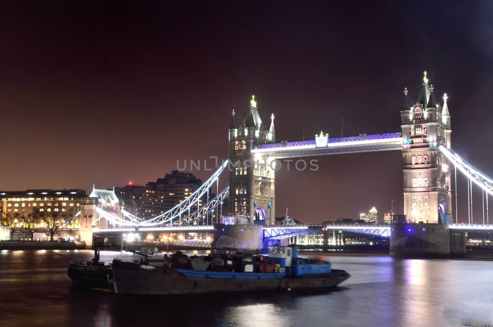 Tower Bridge by night with Boat in foreground