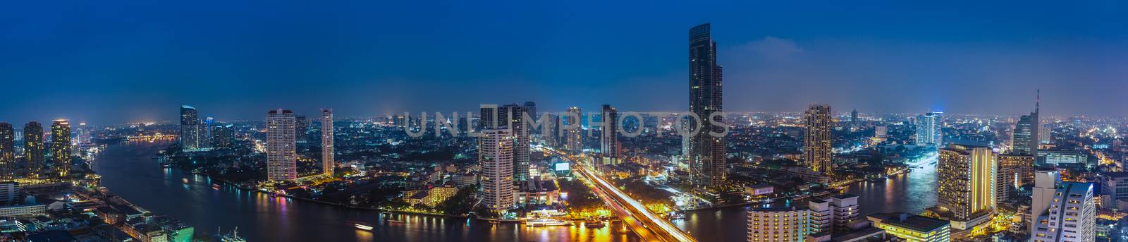 Business Building Bangkok city area at night life with transport by FrameAngel