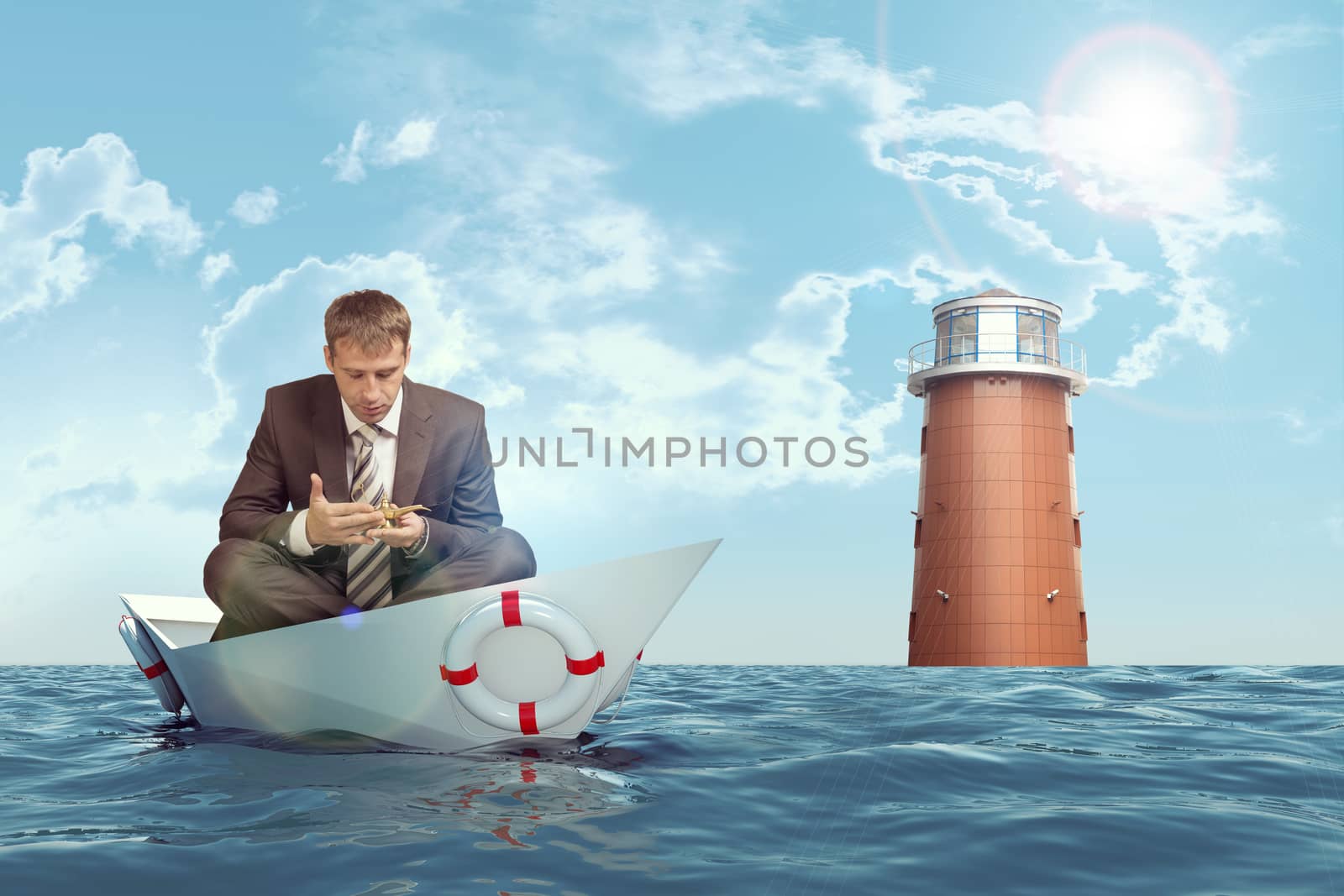 Businessman sitting in lotus position in paper boat in sea and looking at oil lamp