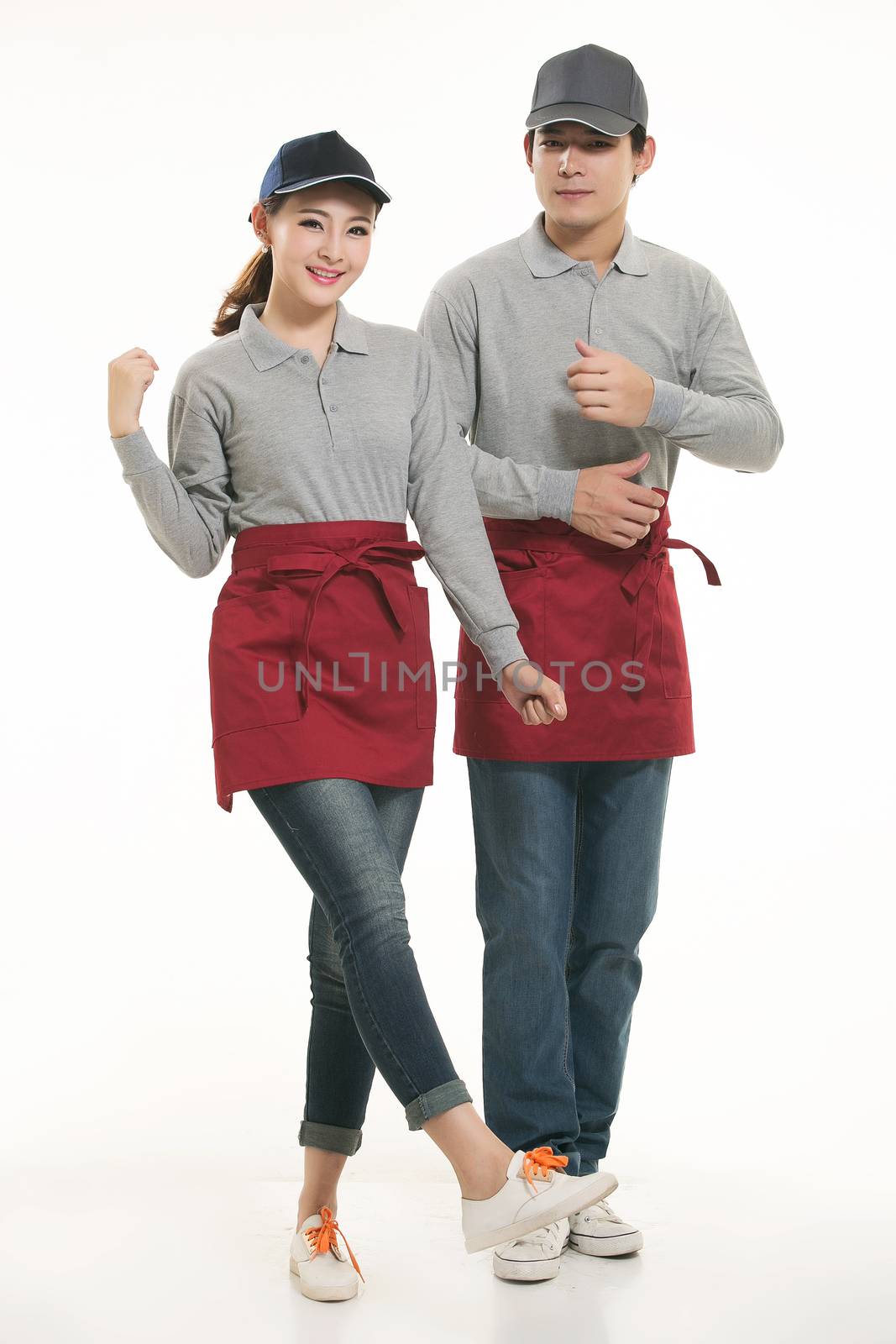 Wear all kinds of T-shirts waiter standing in white background by quweichang